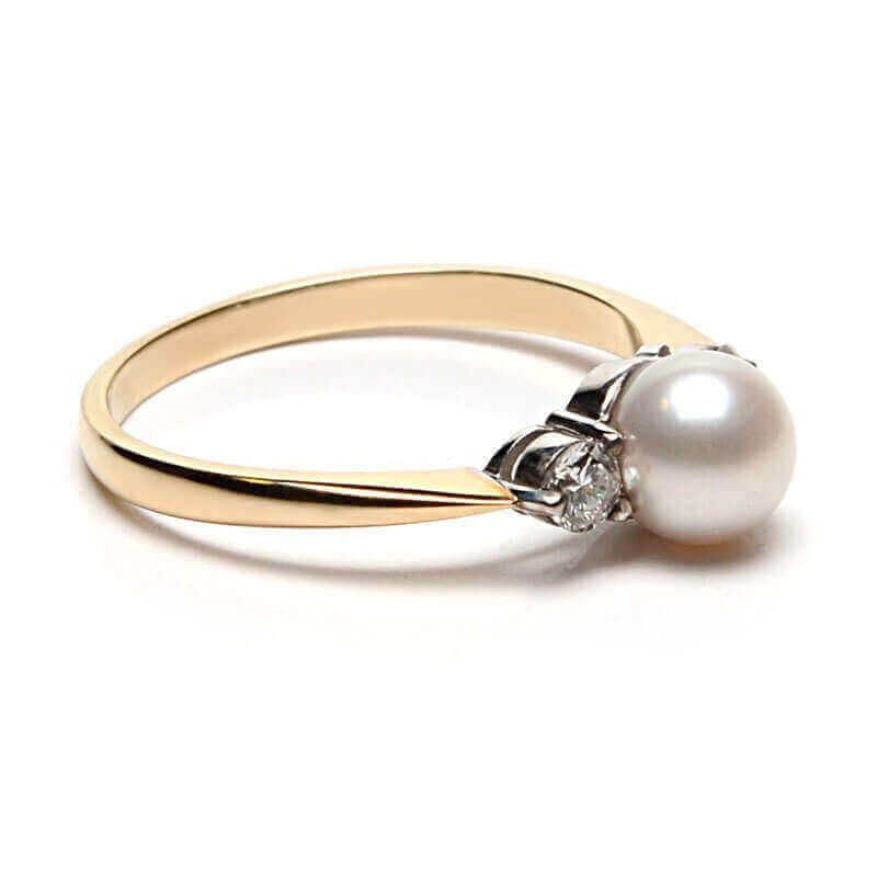 Yellow Gold three stone diamond and pearl ring side view.